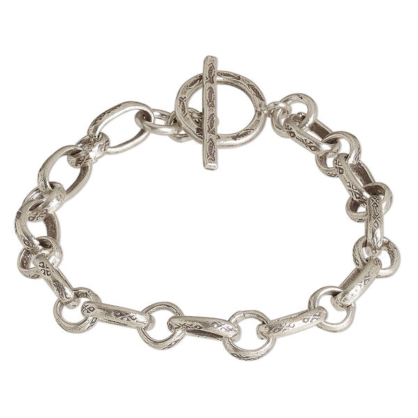 Bracelet, Hill Tribes, antiqued sterling silver, 7mm engraved stamped long and short oval, 6-1/2 inches with toggle clasp. Sold individually. image number 0
