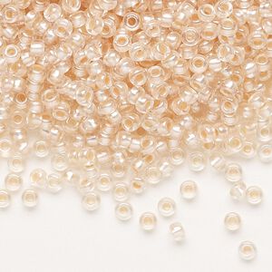 Seed bead, Preciosa Ornela, glass, translucent salmon pearl-lined crystal clear, #8 rocaille. Sold per 50-gram pkg.