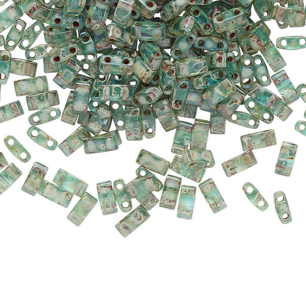 Seed bead, TILA®, glass, pkg/250g, 5x2.3mm half tila rectangle, translucent Picasso turquoise blue, (HTL-4506). image number 0