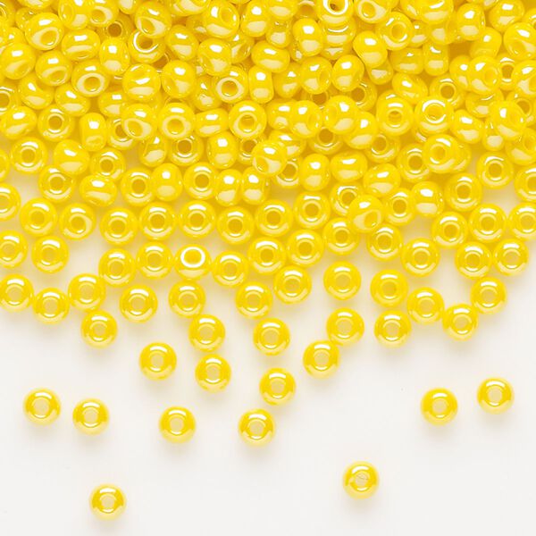 Seed bead, Preciosa Ornela, glass, opaque luster yellow, #8 rocaille. Sold per 500-gram pkg. image number 0