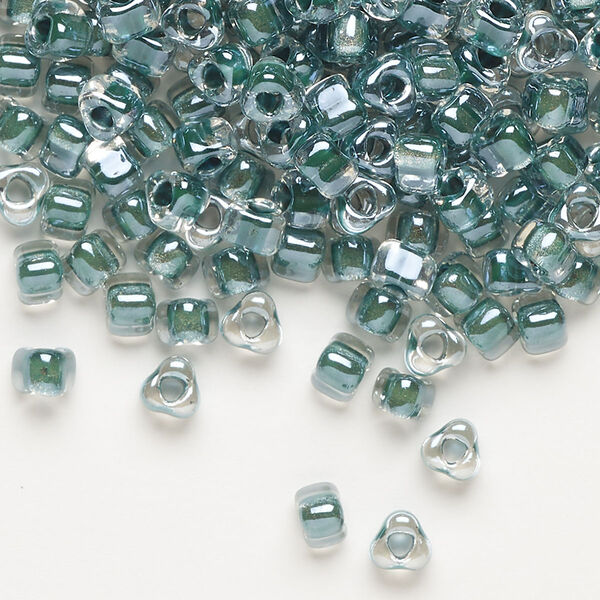 Seed bead, Miyuki, glass, transparent clear color-lined teal, (TR1117), #5 triangle. Sold per 250-gram pkg. image number 0