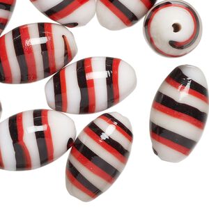 Bead, lampworked glass, opaque red / black / white, 20x11mm oval. Sold per pkg of 10.