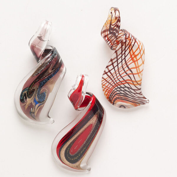 Random focal mix, lampworked glass, pkg/3, opaque to transparent mixed colors with silver-colored foil and copper-colored glitter, 59x27mm-65x32mm twist. image number 0