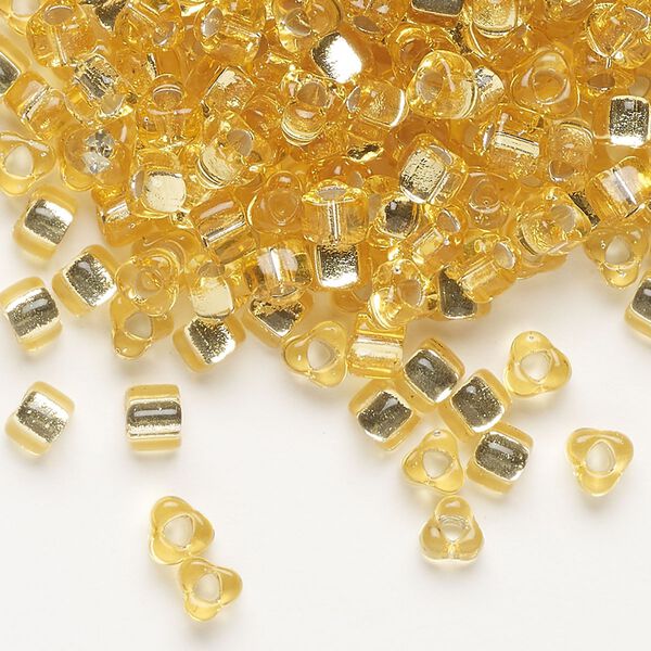 Seed bead, Miyuki, glass, silver-lined translucent amber yellow, (TR1102), #5 triangle. Sold per 250-gram pkg. image number 0
