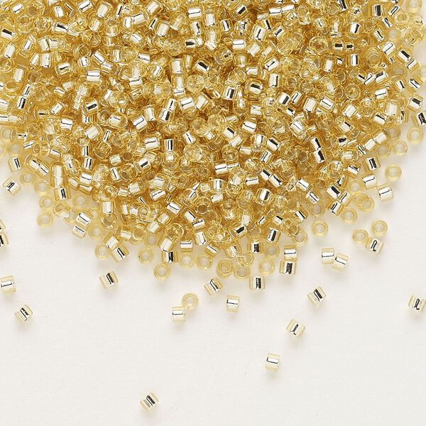 Seed bead, Delica®, glass, pkg/7.5g, #11 round, transparent silver-lined pale topaz (DB-1212). image number 0