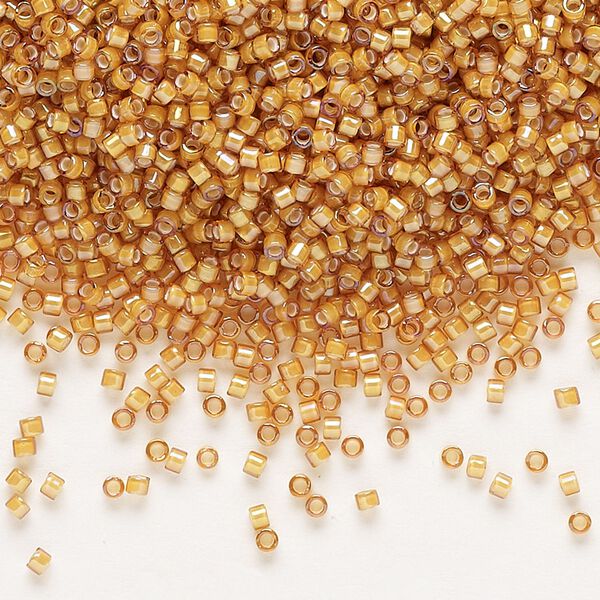 Seed bead, Delica®, glass, pkg/7.5g, #11 round, translucent white-lined luster topaz (DB-1778). image number 0