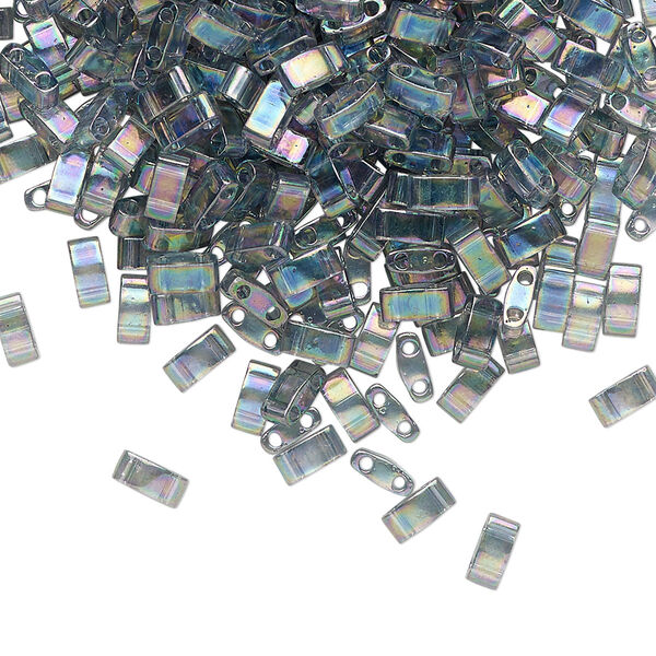 Seed bead, TILA®, glass, pkg/40g, 5x2.3mm half tila rectangle, translucent rainbow luster dark grey, (HTL-2440D). image number 0