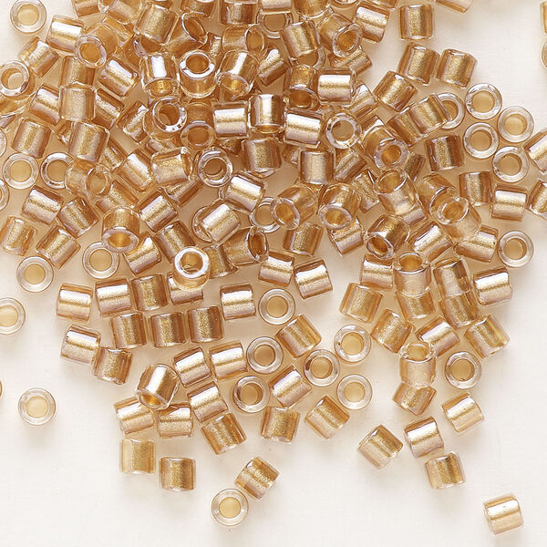 Seed bead, Delica®, glass, pkg/7.5g, #8 round, translucent honey beige-lined luster crystal clear (DBL-0901). image number 0