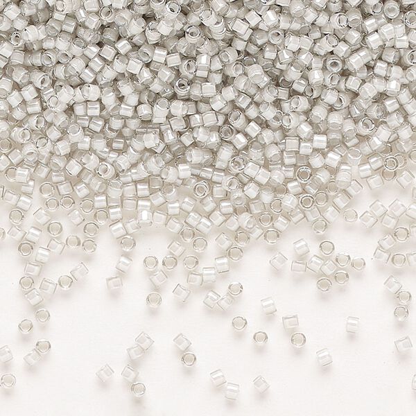 Seed bead, Delica®, glass, pkg/7.5g, #11 round, translucent moonstone-lined luster crystal clear (DB-2391). image number 0
