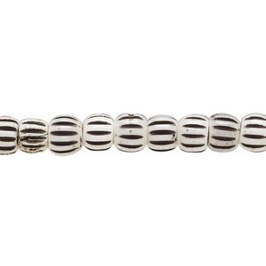 Bead, bone (dyed), white and black, 6.5x5.5mm corrugated barrel. Sold per 15-1/2" to 16" strand.