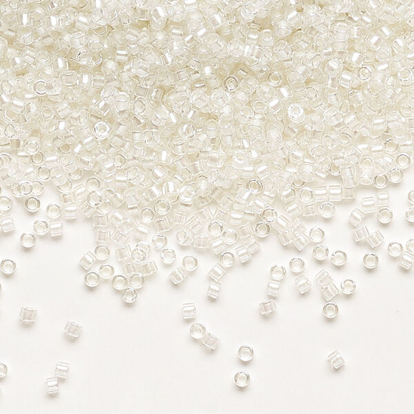 Seed bead, Delica®, glass, pkg/7.5g, #11 round, translucent white pearl-lined rainbow pale beige (DB-1701). image number 0
