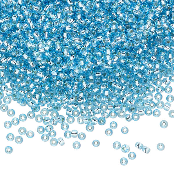 Seed bead, Preciosa Ornela Czech glass, pkg/500g, #11 rocaille, translucent solgel dyed silver-lined turquoise blue, (78134). image number 0