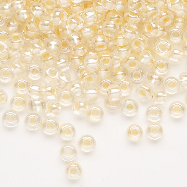 Seed bead, Preciosa Ornela Czech glass, pkg/50g, #6 rocaille, translucent color-lined luster pastel apricot, (382PA). image number 0