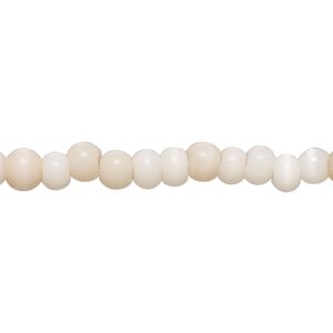 Bead, cat's eye glass (fiber optic glass), soft pink, 5x4mm-6x5mm rondelle and irregular round. Sold per 14-inch strand, approximately 100 beads.