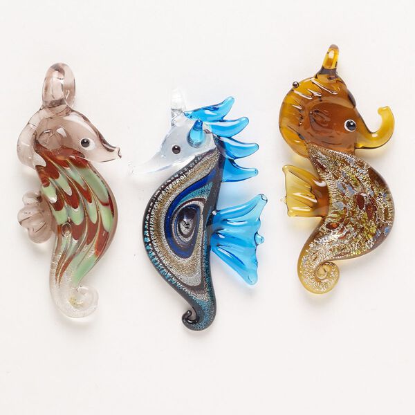 Random focal mix, lampworked glass, pkg/3, opaque and translucent mixed colors with silver-colored foil and copper-colored glitter, 55x28mm-68x35mm seahorse. image number 0