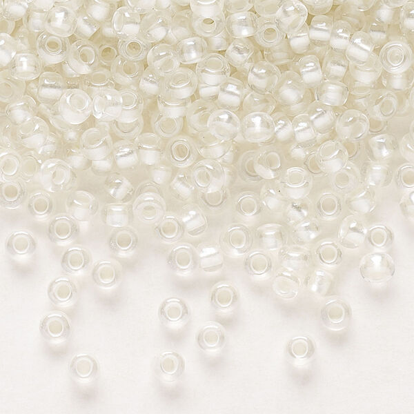 Seed bead, Preciosa Ornela Czech glass, pkg/50g, #8 rocaille, translucent color-lined luster pastel ivory, (382PI). image number 0