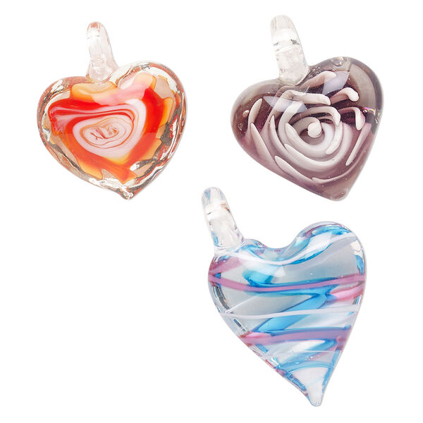 Random focal mix, lampworked glass, pkg/3, translucent and transparent mixed colors, 24x21mm-38x33mm puffed heart with flower and swirl design. image number 0