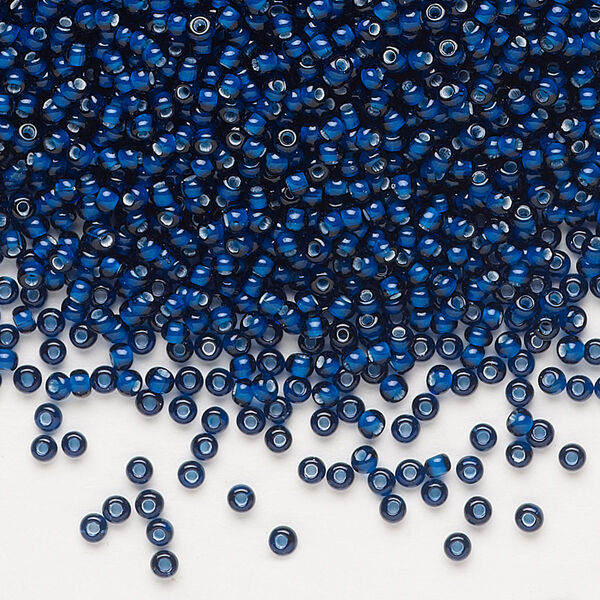 Seed bead, Preciosa Ornela, glass, transparent chalkwhite-lined dark aquamarine, #11 rocaille. Sold per 50-gram pkg. image number 0