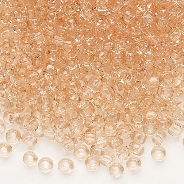 Seed bead, Dyna-Mites™, glass, transparent light peach, #6 round. Sold per 40-gram pkg. image number 0