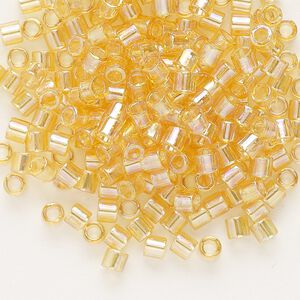 Seed bead, Delica®, glass, pkg/7.5g, #8 round, translucent rainbow light topaz (DBL-0100).