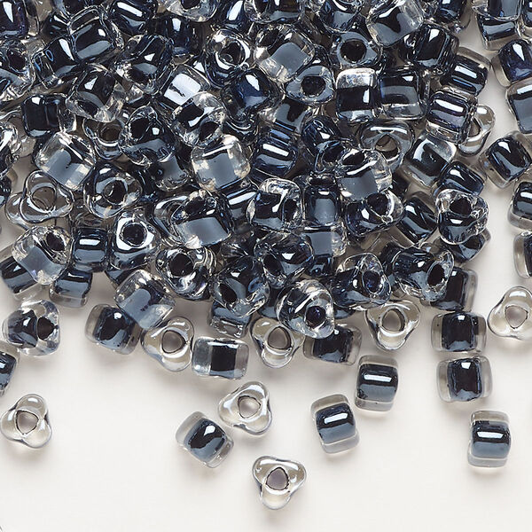 Seed bead, Miyuki, glass, transparent clear color-lined black, (TR1106), #5 triangle. Sold per 250-gram pkg. image number 0