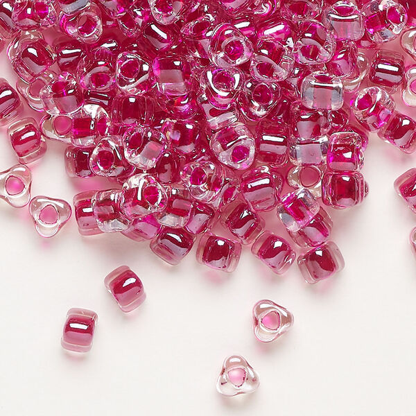 Seed bead, Miyuki 1pkg10g, glass, #5 triangle, transparent cranberry inside dyed color clear (TR-1140) image number 0