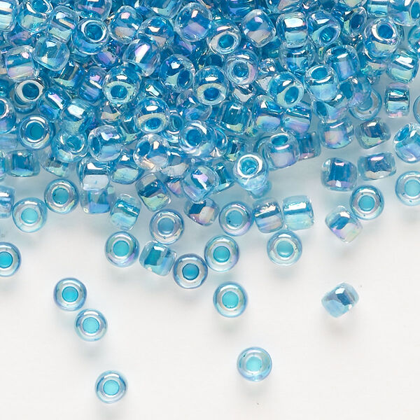 Seed bead, Dyna-Mites™, glass, transparent rainbow inside color teal, #6 round. Sold per 1/2 kilogram pkg. image number 0