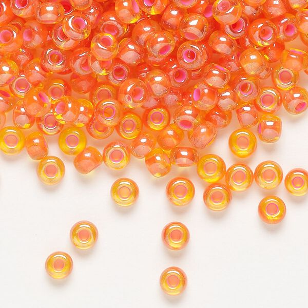 Seed bead, Preciosa Ornela, glass, translucent pink-lined luster yellow amber, #6 rocaille. Sold per 50-gram pkg. image number 0