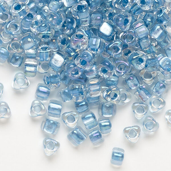 Seed bead, Miyuki, glass, transparent clear color-lined sea blue, (TR1137), #5 triangle. Sold per 250-gram pkg. image number 0