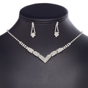 Necklace and earring set, glass rhinestone / plastic / imitation rhodium-plated brass / steel, clear, cupchain and "V" shape, 16 inches with 3-inch extender chain and lobster claw clasp, 28mm earrings with post. Sold per set.