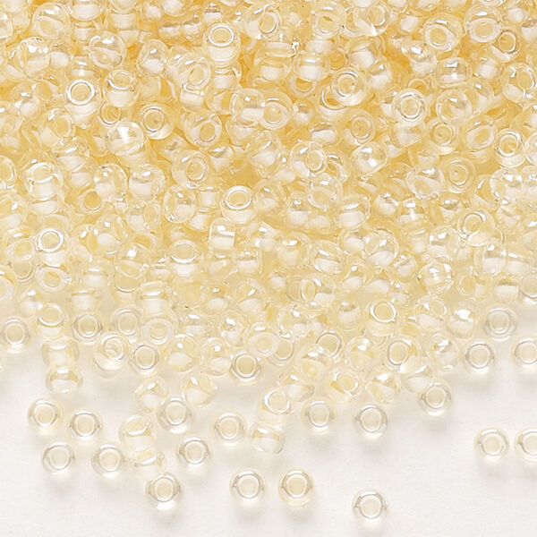 Seed bead, Preciosa Ornela Czech glass, pkg/50g, #11 rocaille, translucent color-lined luster pastel apricot, (382PA). image number 0