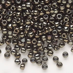 Seed bead, Dyna-Mites™, glass, opaque iris gold, #6 round. Sold per 40-gram pkg.