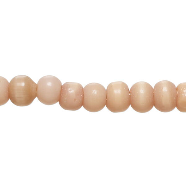 Bead, cat's eye glass (fiber optic glass), peach, 6-8mm irregular round. Sold per 14-inch strand, approximately 70 beads. image number 0