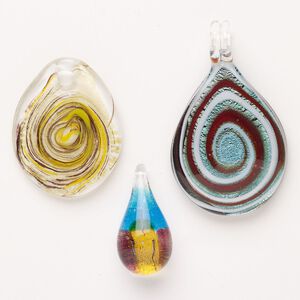 Random focal mix, lampworked glass, opaque mixed colors with silver-colored foil and copper-colored glitter, 33x18mm-61x40mm top-drilled teardrop. Sold per pkg of 3.