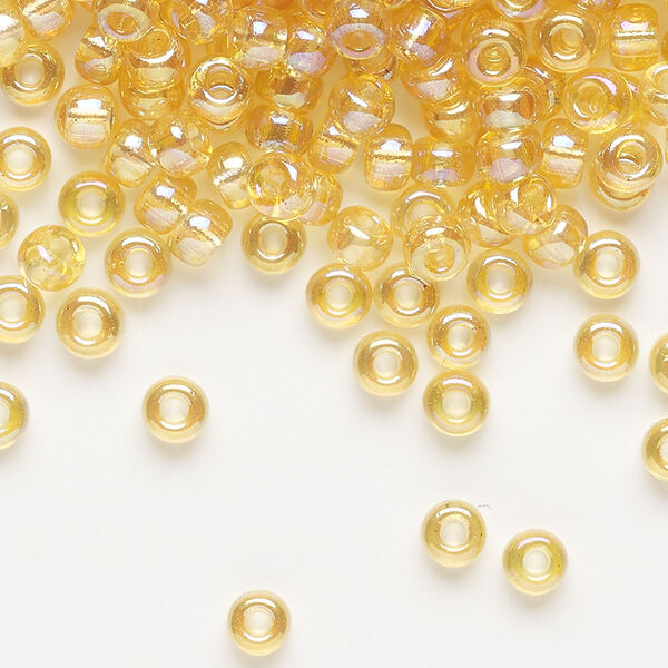 Seed bead, Miyuki, glass, pkg/25g, #6 rocaille, translucent rainbow light topaz (RR-251). image number 0