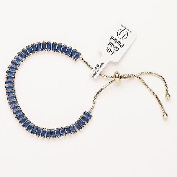 Bracelet, adjustable, brass / glass / silicone, pkg/1, 6 to 10 inches, gold plate and blue sapphire. image number 0