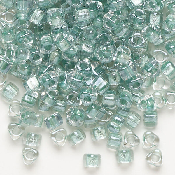 Seed bead, Miyuki, glass, transparent clear color-lined light blue, (TR1128), #5 triangle. Sold per 250-gram pkg. image number 0