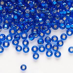 Seed bead, Preciosa Ornela Czech glass, pkg/50g, #6 rocaille, transparent silver-lined sapphire blue, (67300).