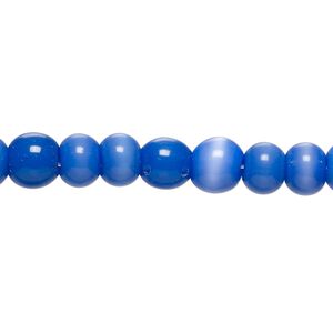 Bead, cat's eye glass (fiber optic glass), blue, 5-7mm irregular round. Sold per 14-inch strand, approximately 65 beads.