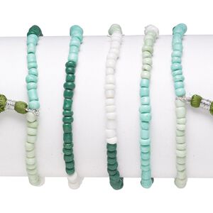 Bracelet mix, stretch, glass, white / teal / soft green, #6 round with 45mm tassel, 7-1/2 inches. Sold per pkg of 5.