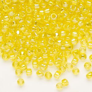 Seed bead, Dyna-Mites™, glass, transparent rainbow yellow, #6 round. Sold per 40-gram pkg.
