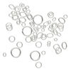 Jump ring mix, sterling silver, 3-10mm round with 1.4-7.6mm inside diameter and 4x3mm-7x5mm oval with 2.5x1.5mm-5x3.3mm inside diameter, 20-26 gauge. Sold per 5-gram pkg, approximately 75-85 jump rings. image number 1