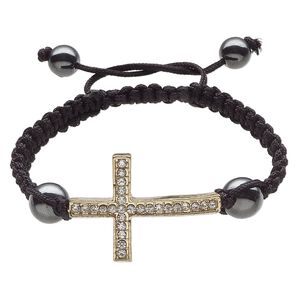 Bracelet, Hemalyke™ (man-made) / glass rhinestone / waxed cotton cord / gold-finished "pewter" (zinc-based alloy), black and clear, 36.5x26mm curved cross, adjustable from 6-8 inches with macramé knot closure. Sold individually.