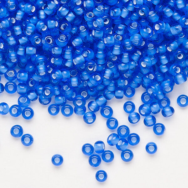 Seed bead, Preciosa Ornela, glass, transparent chalkwhite-lined sapphire, #8 rocaille. Sold per 500-gram pkg. image number 0