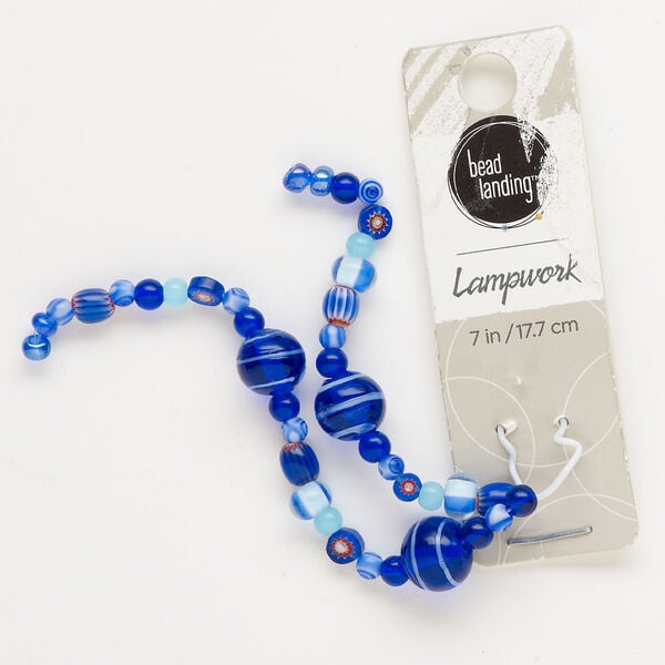 Bead, lampworked glass, translucent multi-blue, 4-10mm mixed shapes. Sold per 7-inch strand, approximately 40 beads. image number 0
