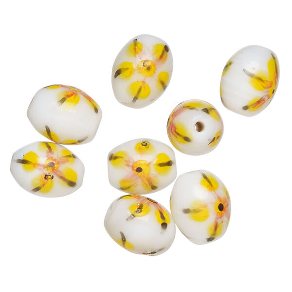 Bead, lampworked glass, opaque white / black / yellow, 14x11mm-13x10mm oval with painted flower design. Sold per pkg of 8. image number 0