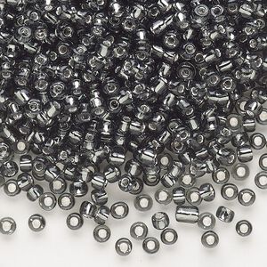Seed bead, Dyna-Mites™, glass, silver-lined translucent gunmetal, #8 round. Sold per 1/2 kilogram pkg.
