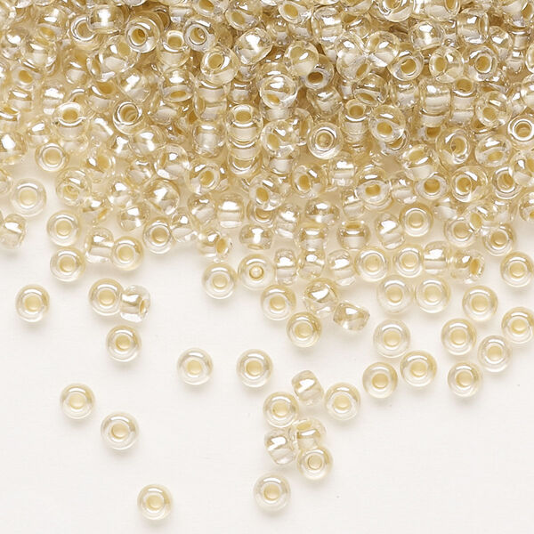 Seed bead, Preciosa Ornela, glass, translucent mocca pearl-lined crystal clear, #8 rocaille. Sold per 500-gram pkg. image number 0