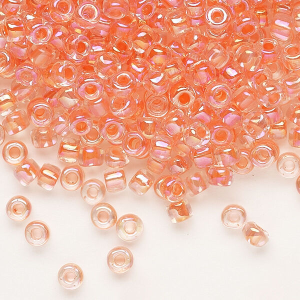 Seed bead, Dyna-Mites™, glass, transparent rainbow inside color peach, #6 round. Sold per 40-gram pkg. image number 0