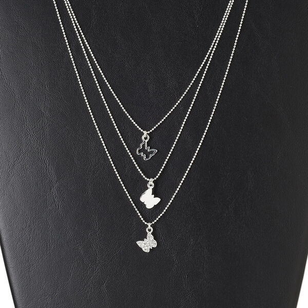 Necklace, 3-strand, silver-finished "pewter" (zinc-based alloy) and brass, glass, clear, 10x9mm butterfly / 10x9mm butterfly / 10x9mm open butterfly, 17-1/2 inches with 3-inch extender chain and lobster claw clasp. Sold individually. image number 0